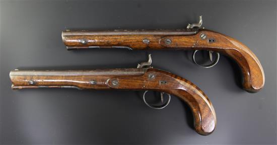A pair of early 19th century percussion lock pistols, by Wogdon of London, 14in.